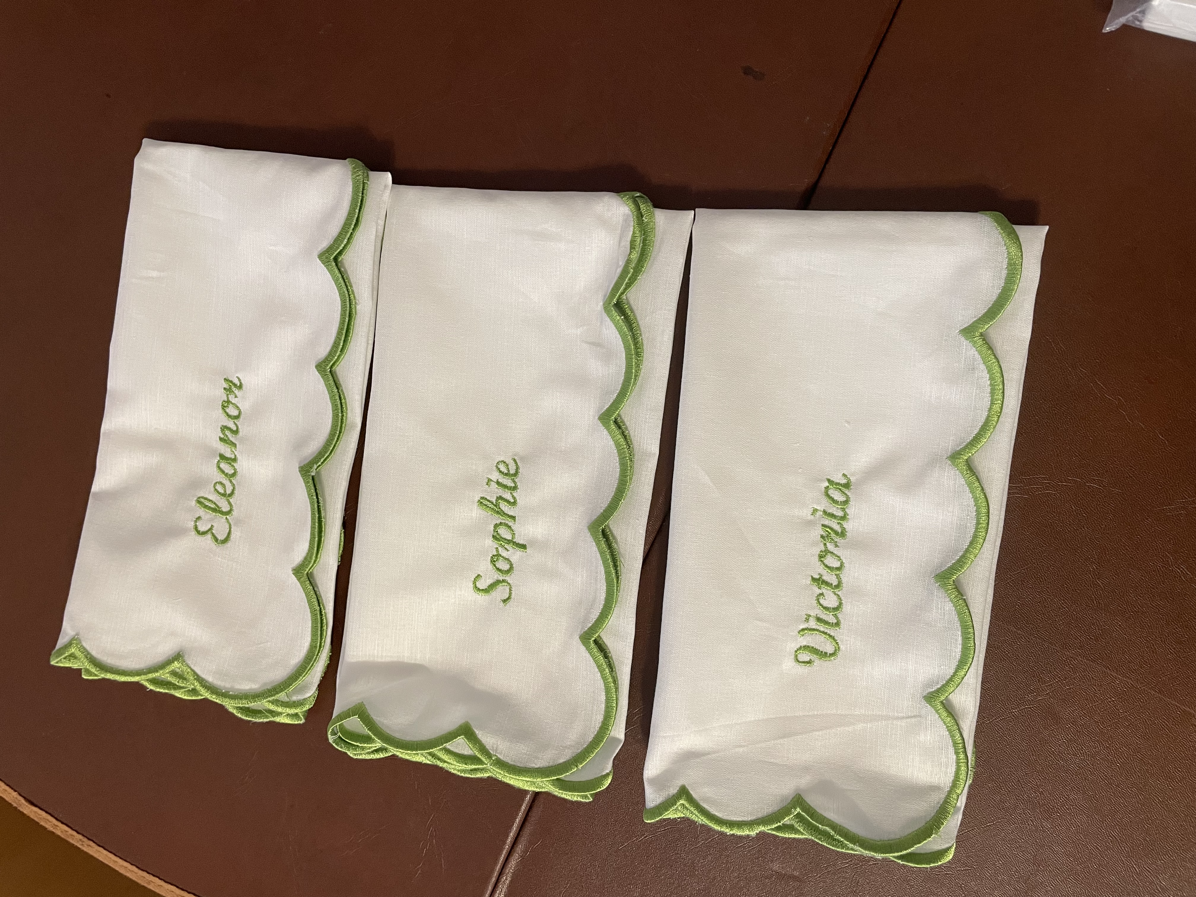 Personalised embroidered wedding napkins made using the rented embroidery machine.